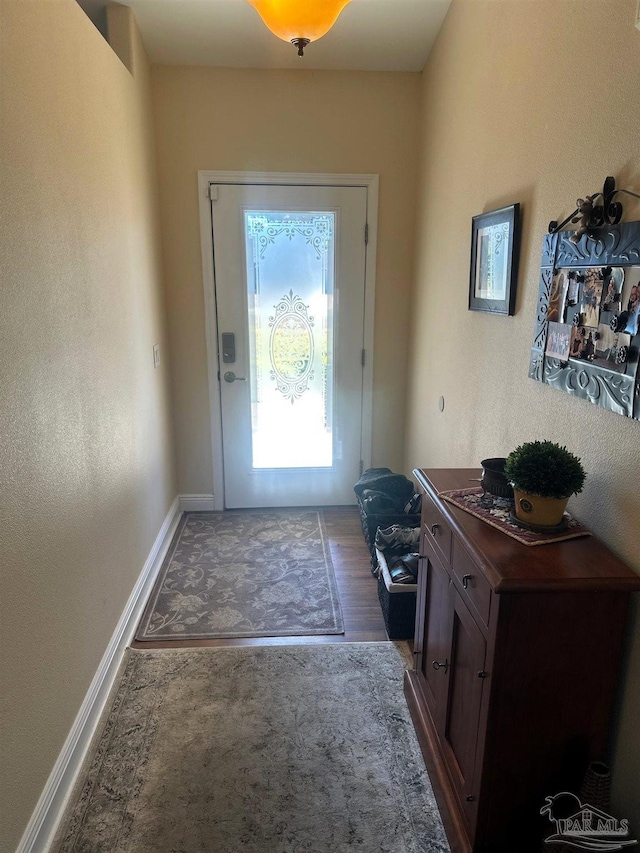 doorway featuring dark hardwood / wood-style floors