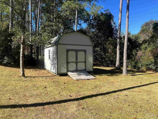 view of outdoor structure with a lawn