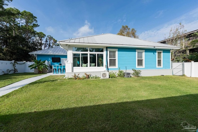 back of property featuring a yard, cooling unit, and ac unit