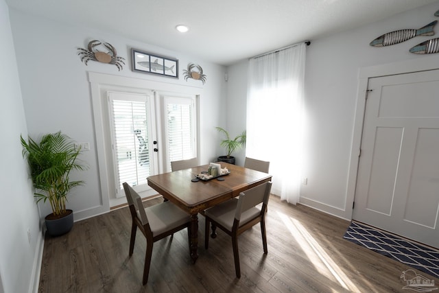 dining area featuring dark hardwood / wood-style floors