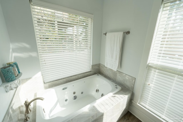 bathroom with tiled tub