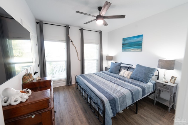 bedroom featuring ceiling fan and dark hardwood / wood-style floors