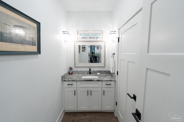 bathroom featuring hardwood / wood-style floors and vanity