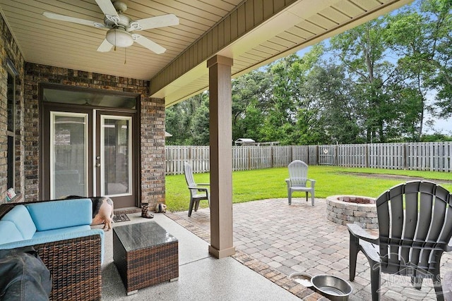 view of patio featuring a fire pit and a ceiling fan