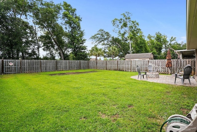 view of yard with a patio area and a fire pit