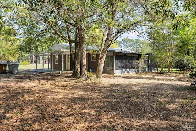 back of property featuring a sunroom