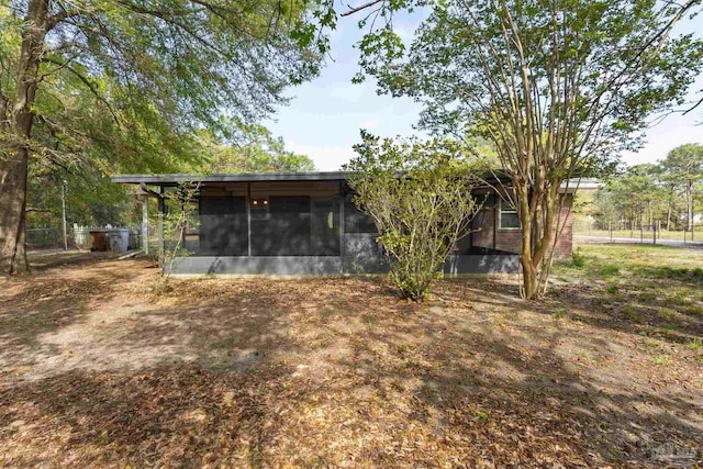 rear view of house with a sunroom