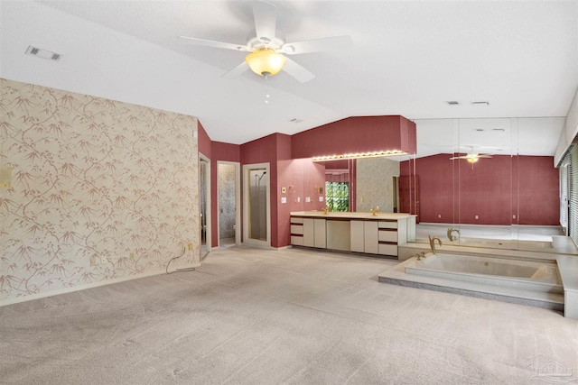 kitchen featuring wallpapered walls, carpet, vaulted ceiling, visible vents, and a ceiling fan