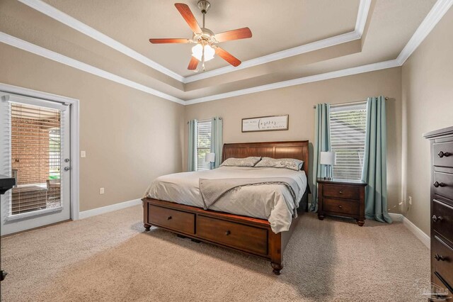 8847 Salt Grass Dr, Pensacola, FL 32526 - carpeted bedroom featuring access to outside, ornamental molding, a raised ceiling, and multiple windows