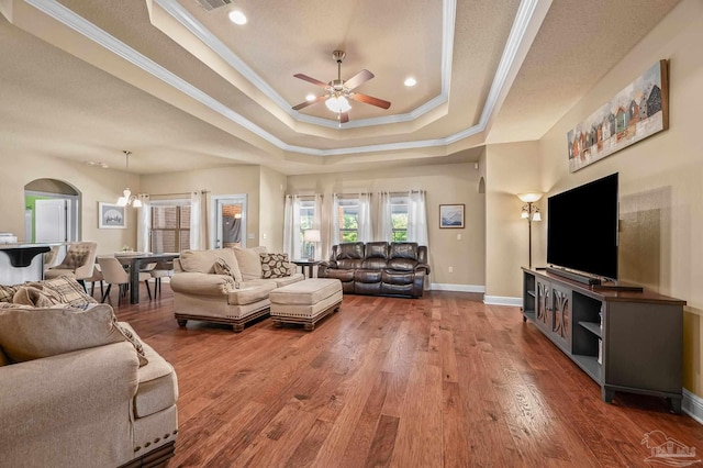 8847 Salt Grass Dr, Pensacola, FL 32526 - living room with ceiling fan, crown molding, wood finished floors, a raised ceiling, and baseboards