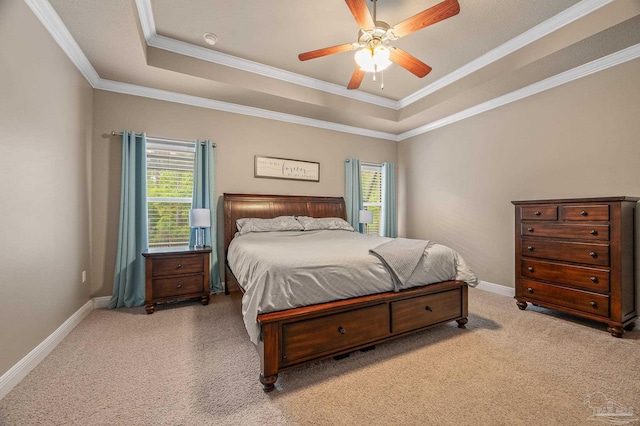 8847 Salt Grass Dr, Pensacola, FL 32526 - bedroom featuring light colored carpet, ornamental molding, a tray ceiling, and multiple windows