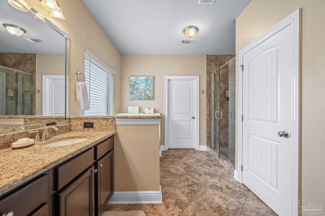 8847 Salt Grass Dr, Pensacola, FL 32526 - full bathroom with vanity, a shower stall, tile patterned floors, and visible vents