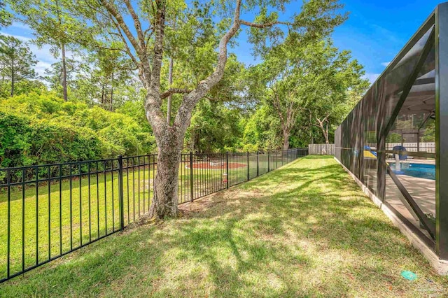 8847 Salt Grass Dr, Pensacola, FL 32526 - view of yard featuring a fenced in pool, a fenced backyard, and glass enclosure