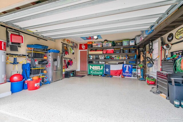 8847 Salt Grass Dr, Pensacola, FL 32526 - garage featuring stainless steel refrigerator with ice dispenser