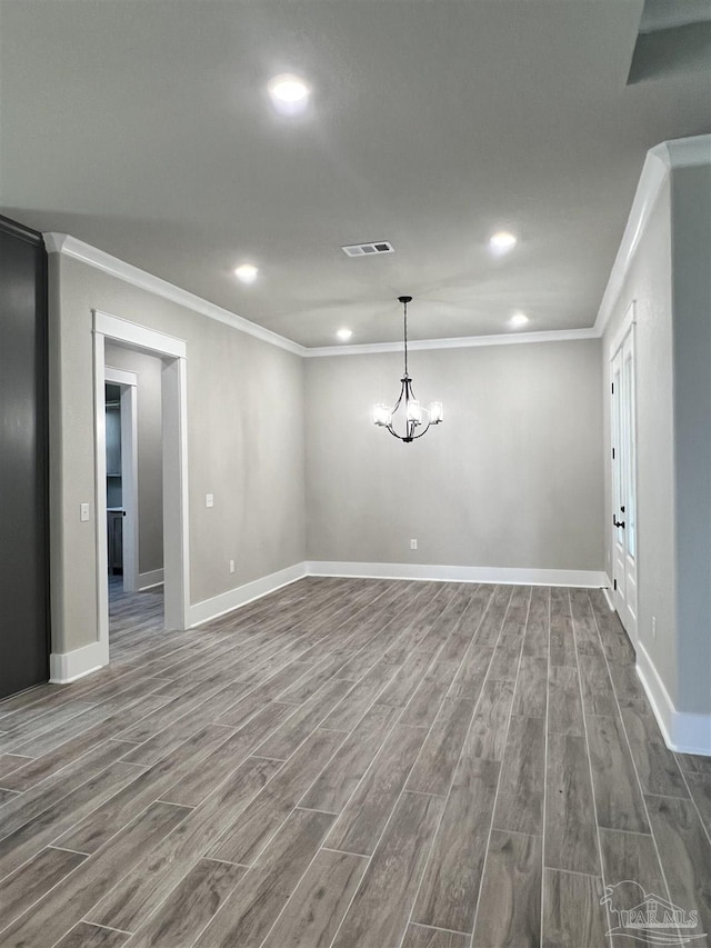 2440 Meeting St, Cantonment, FL 32533 - unfurnished room featuring wood-type flooring, ornamental molding, and a notable chandelier