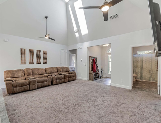 unfurnished living room featuring ceiling fan, light carpet, and high vaulted ceiling