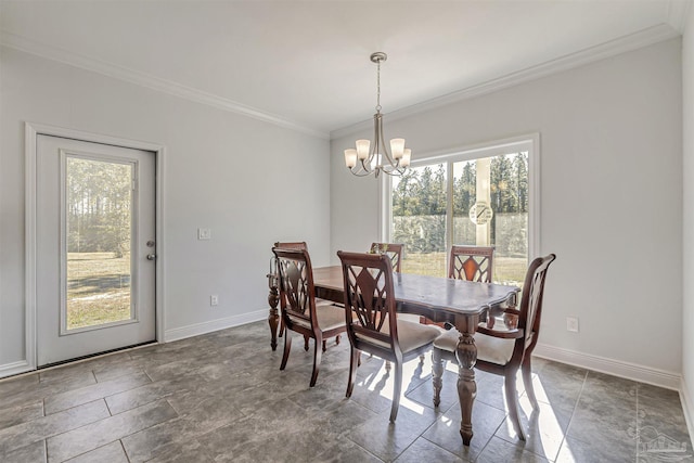 dining room with a notable chandelier and crown molding