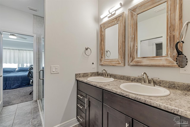 bathroom featuring tile patterned flooring and vanity