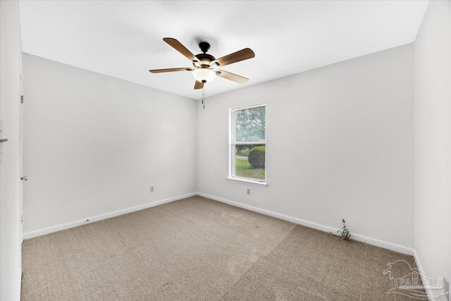 unfurnished room with carpet floors, ceiling fan, and baseboards