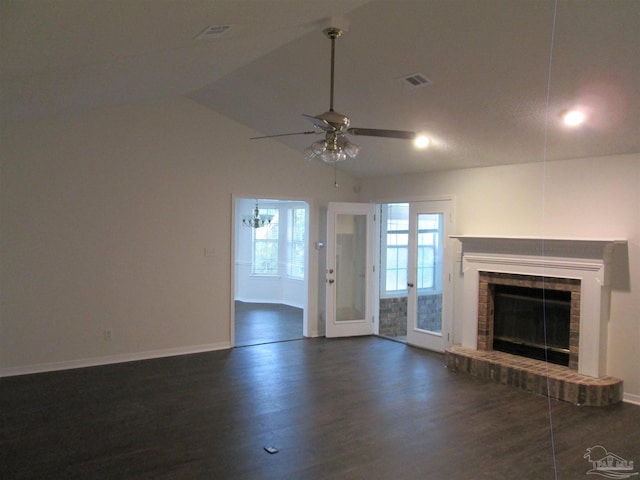 unfurnished living room with ceiling fan, baseboards, dark wood-type flooring, a fireplace, and vaulted ceiling