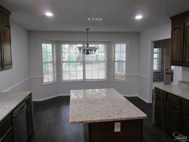 kitchen with recessed lighting, healthy amount of natural light, a chandelier, dark wood finished floors, and baseboards