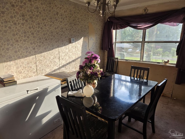 35 N Cypress St, Mcdavid, FL 32568 - dining area with plenty of natural light, a chandelier, and carpet flooring