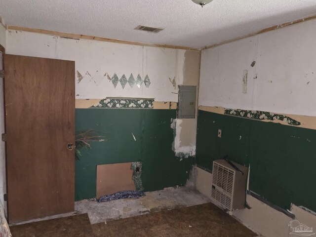 35 N Cypress St, Mcdavid, FL 32568 - misc room with electric panel and a textured ceiling