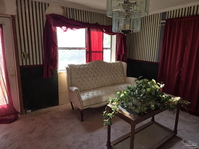 35 N Cypress St, Mcdavid, FL 32568 - carpeted living area with wallpapered walls and a chandelier