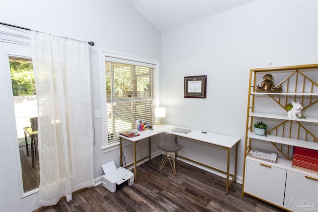 home office with vaulted ceiling, a wealth of natural light, and dark hardwood / wood-style flooring