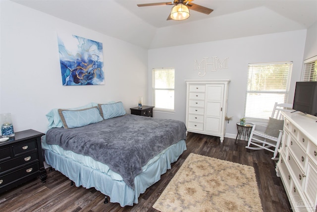 bedroom with lofted ceiling, dark hardwood / wood-style floors, and ceiling fan