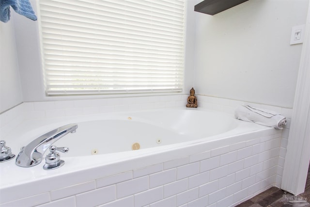 bathroom featuring a relaxing tiled tub