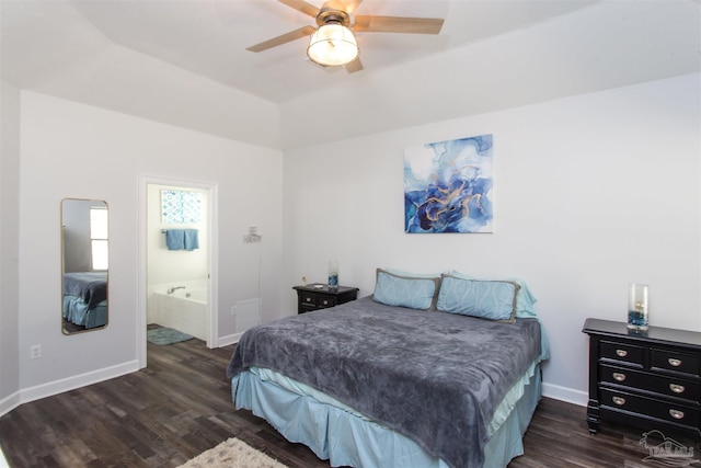 bedroom with ceiling fan, ensuite bath, and dark hardwood / wood-style floors