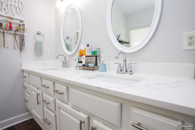 bathroom featuring vanity and wood-type flooring