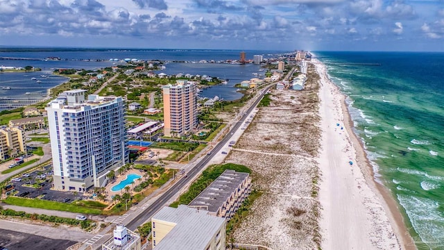 birds eye view of property featuring a view of the beach and a water view