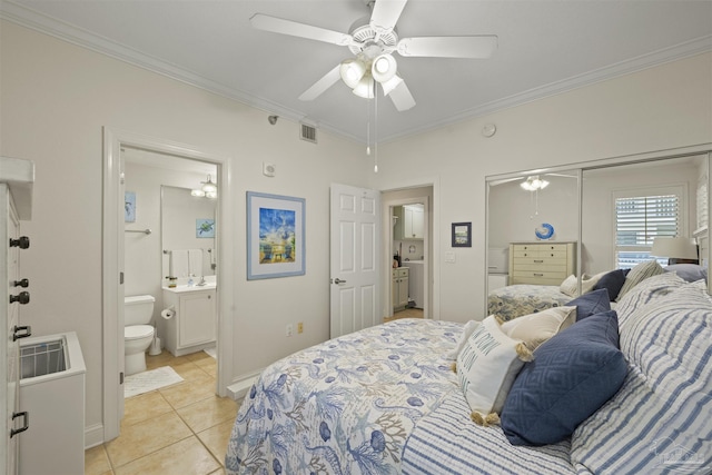 bedroom with crown molding, baseboards, light tile patterned floors, and visible vents
