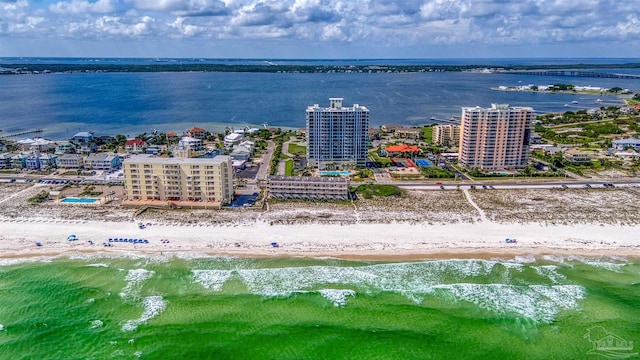 birds eye view of property featuring a water view and a view of the beach