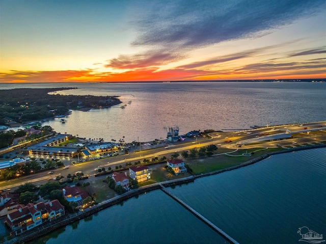 aerial view at dusk with a water view