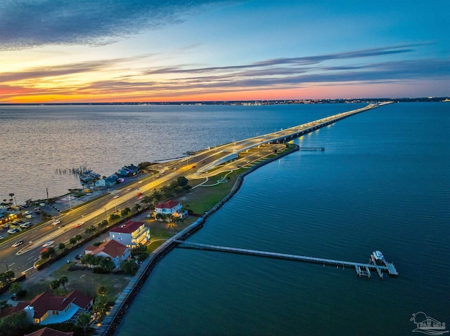 aerial view at dusk with a water view