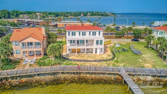 birds eye view of property featuring a water view