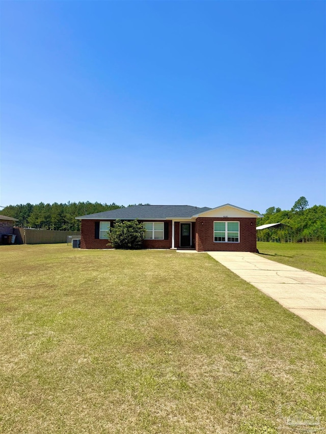 ranch-style home with a front lawn, driveway, and brick siding