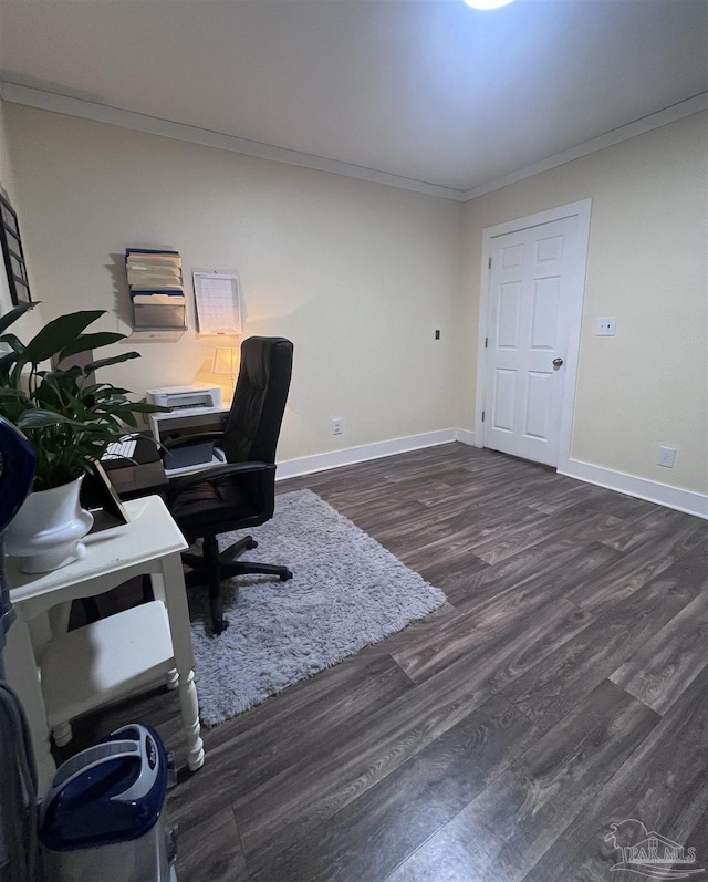 home office with wood finished floors, ornamental molding, and baseboards