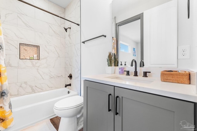 full bathroom with vanity, toilet, and shower / bath combo