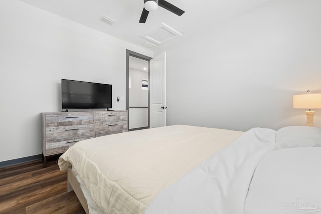 bedroom with dark wood-type flooring and ceiling fan