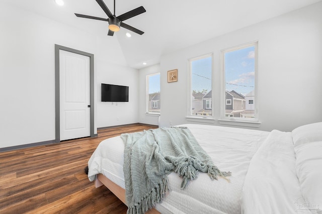 bedroom featuring hardwood / wood-style flooring, ceiling fan, and lofted ceiling