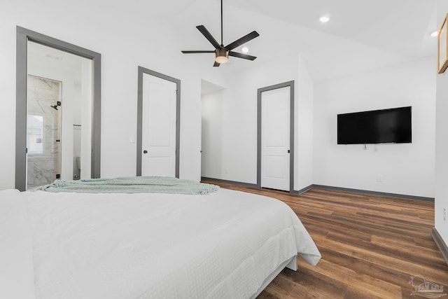 bedroom with vaulted ceiling, dark hardwood / wood-style floors, ensuite bathroom, and ceiling fan