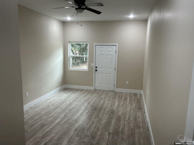 spare room with ceiling fan and light hardwood / wood-style flooring