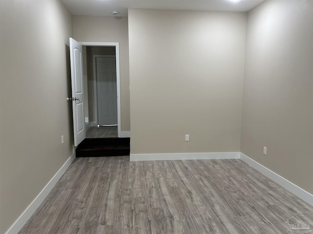 spare room with light hardwood / wood-style floors