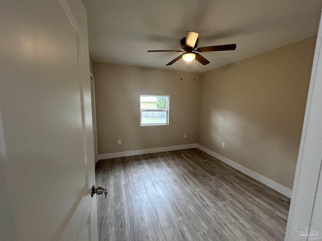 unfurnished room with ceiling fan and light wood-type flooring