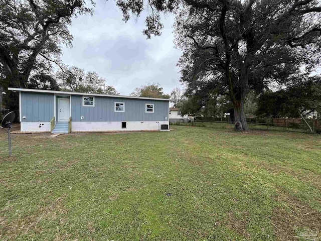 exterior space with a yard and central AC unit