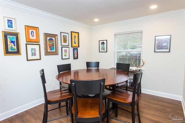 dining area with dark wood finished floors, baseboards, and ornamental molding
